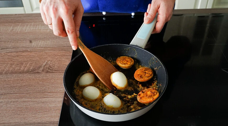 Fried boiled eggs with spices