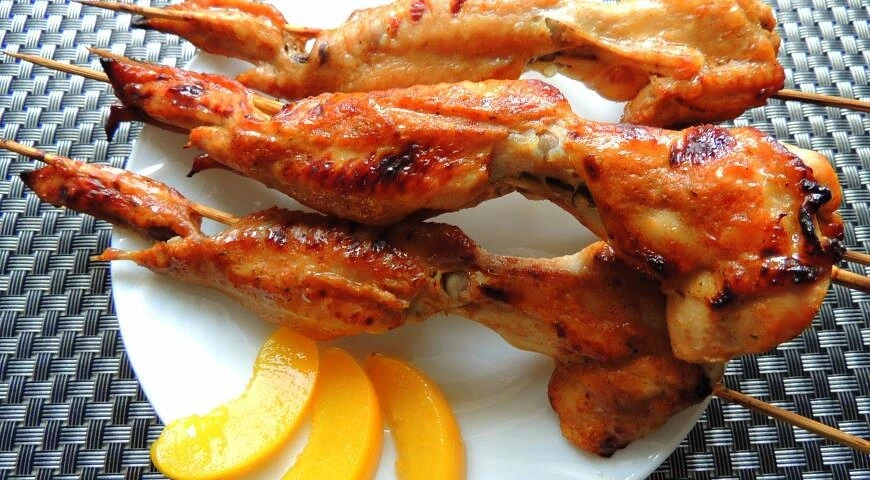 Grilled wings in peach marinade