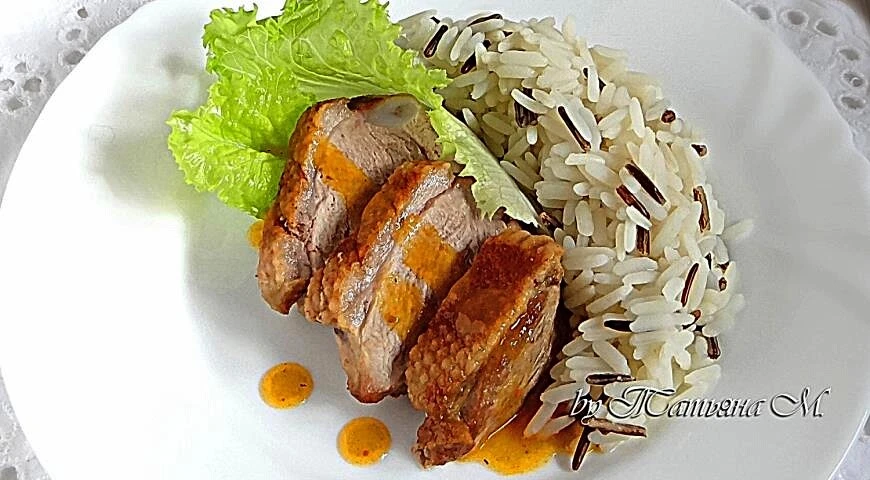 Duck breast with rice and spicy carrot sauce