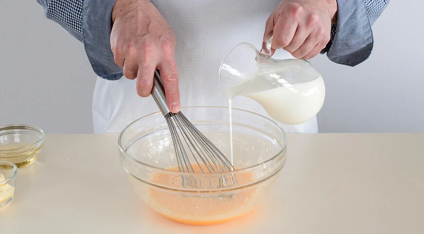 Openwork pancakes in milk with yeast