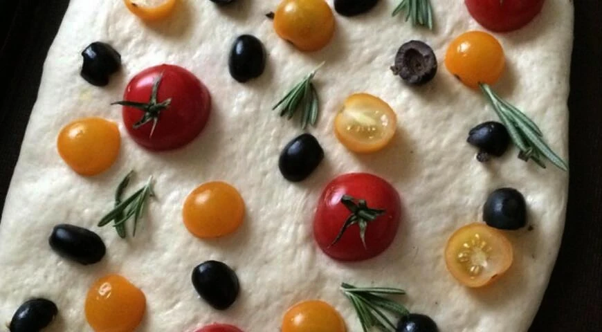 Focaccia with tomatoes, olives and rosemary