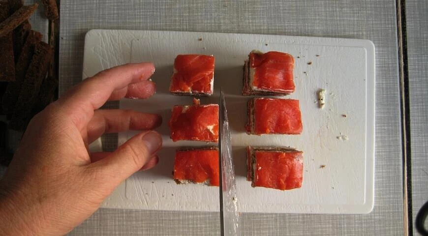 Canape with smoked sockeye salmon and curd cheese