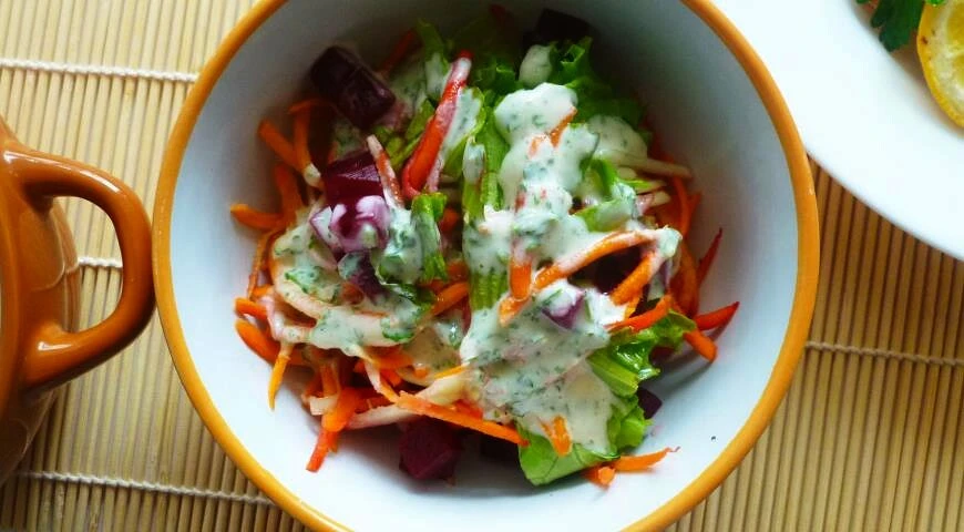 Salad of zucchini, carrots and beets with spicy dressing