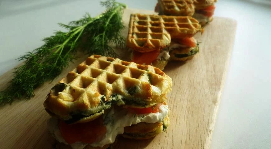Waffles with spinach, cheese and salmon