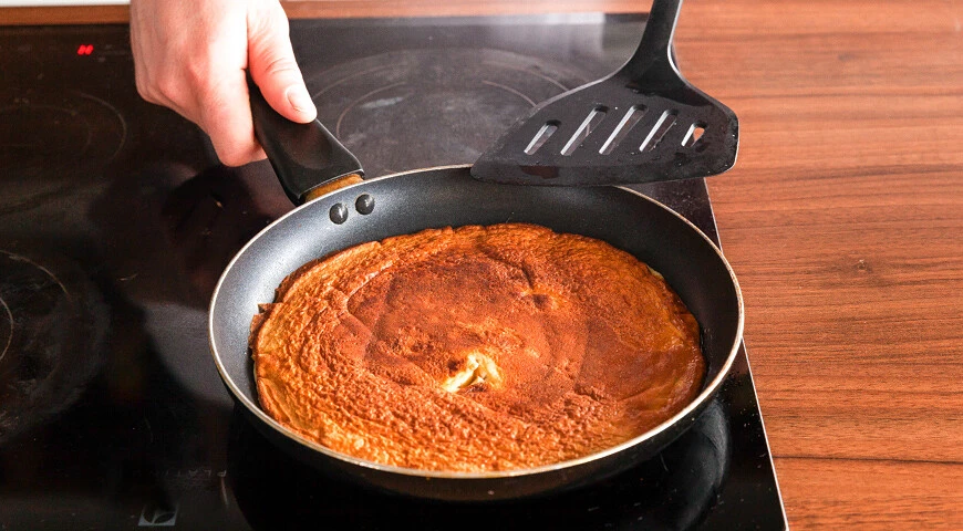 Omelet with flour in a pan