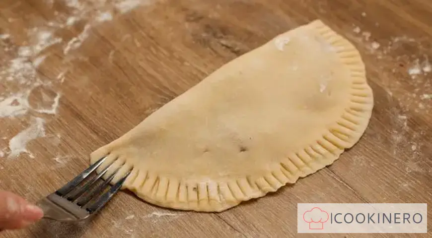 Chebureki in a frying pan