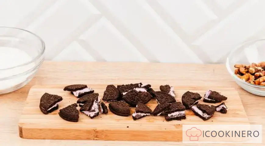 Creamy dessert with meringue, Oreo and nuts