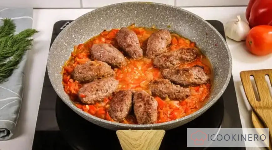 Chevapchichi in bell pepper and tomato sauce
