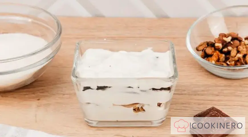 Creamy dessert with meringue, Oreo and nuts