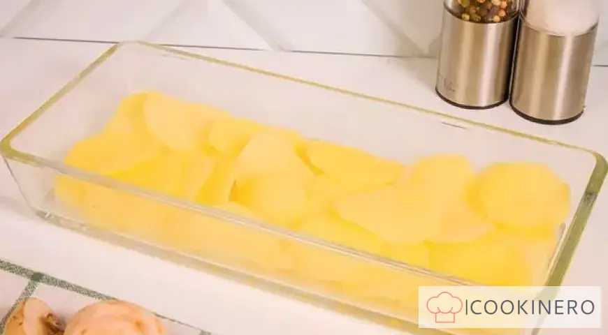 Potato casserole with cheese, chicken and mushrooms