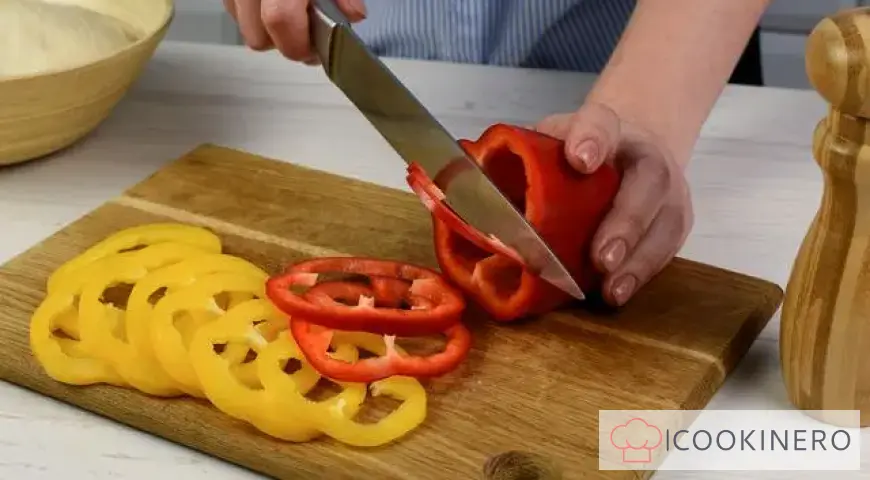 Homemade pizza with ham, smoked sausage and bell pepper