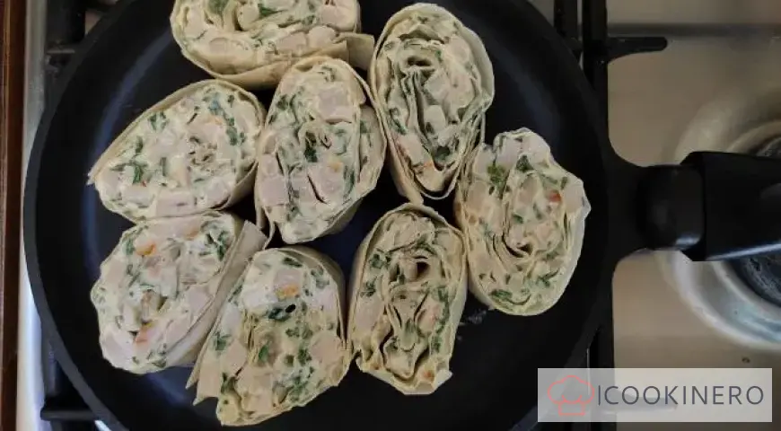 Lavash with smoked chicken in a frying pan
