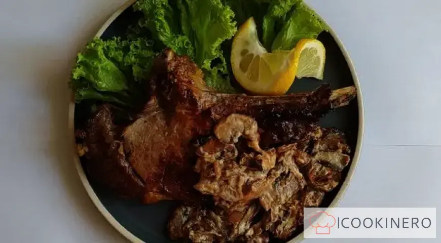 Appetizing bone-in steak with mushrooms in a creamy sauce