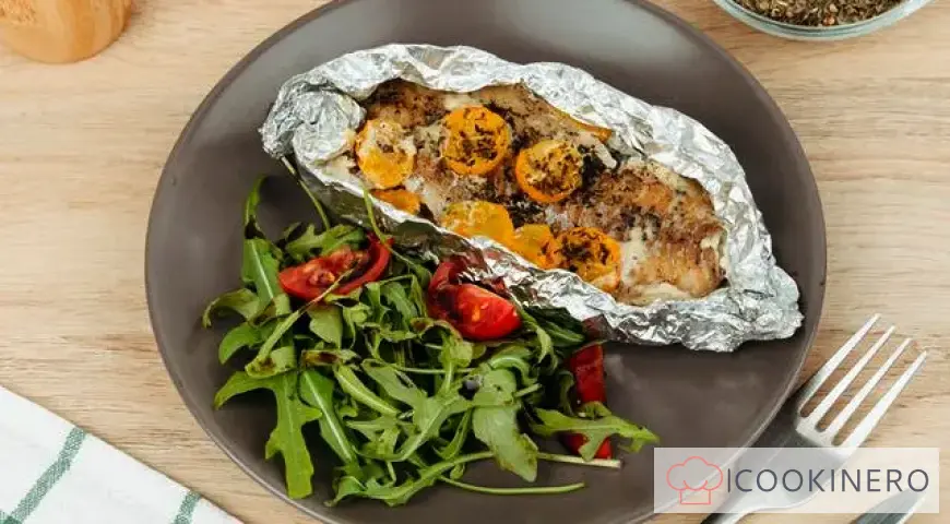 Pollock baked in cream and cherry tomatoes