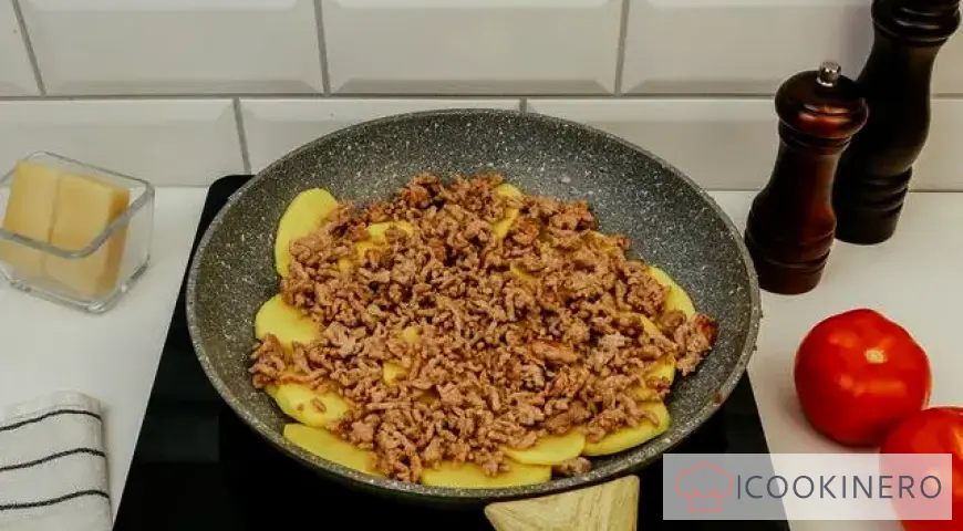 Potato casserole with minced meat in a frying pan