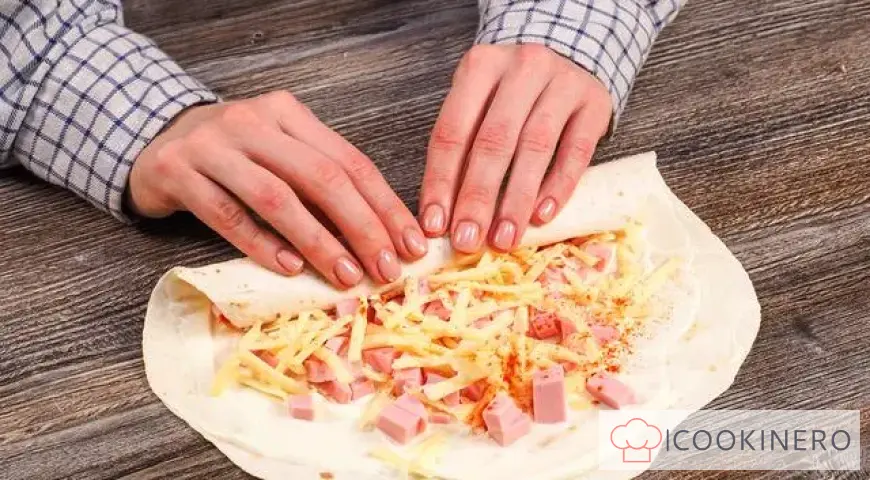 Fried lavash with sausage and cheese