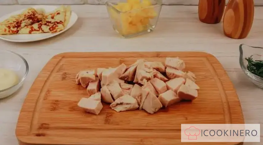 Salad with egg pancakes, chicken and pineapple