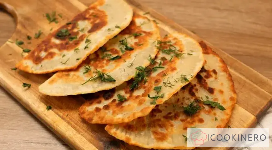 Chebureki in a frying pan