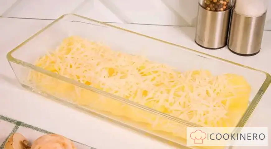 Potato casserole with cheese, chicken and mushrooms