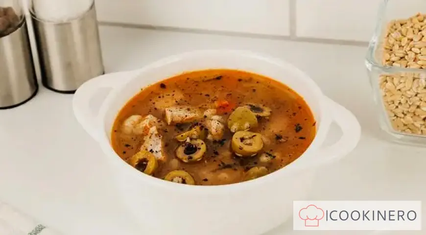 Pickle soup with olives