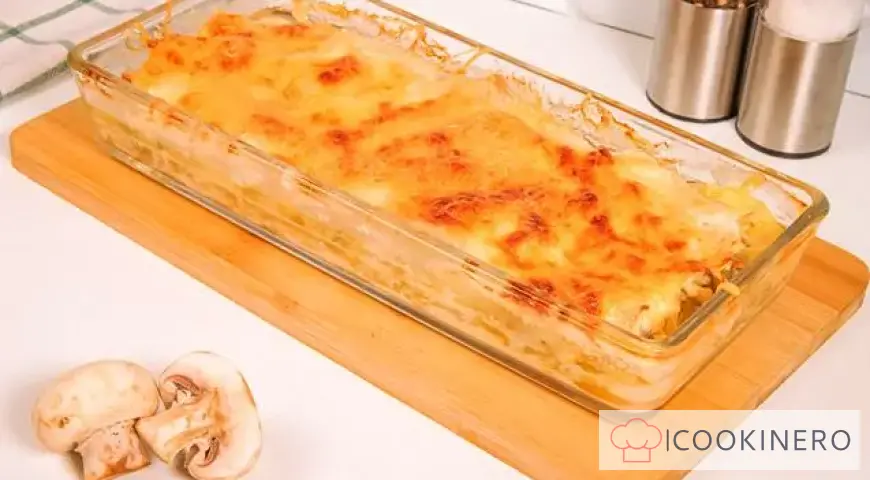 Potato casserole with cheese, chicken and mushrooms