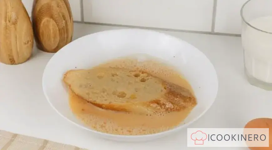 French toast with egg and milk in a frying pan