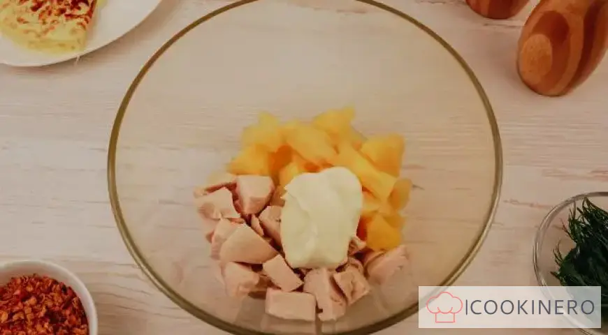 Salad with egg pancakes, chicken and pineapple