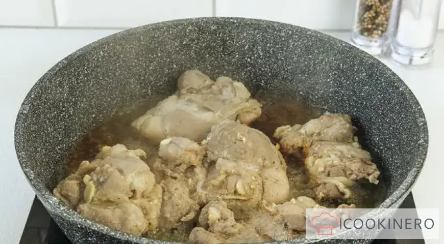 Chicken thighs in a frying pan