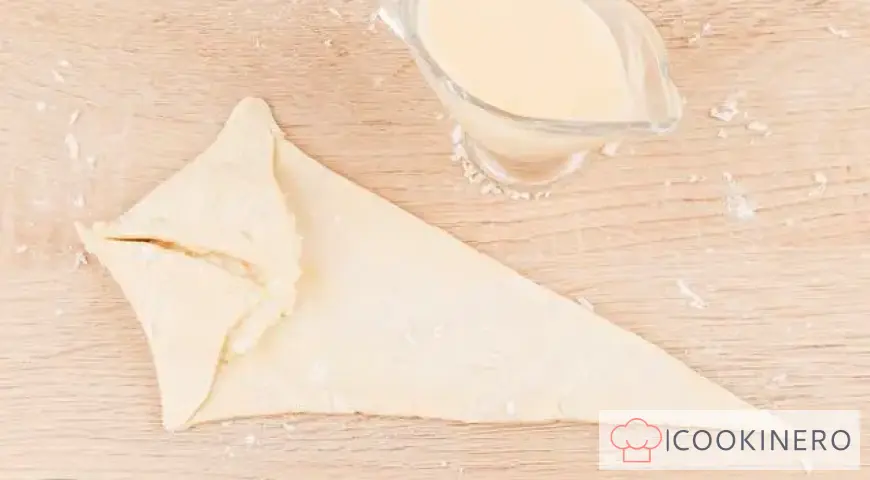 Croissants with condensed milk and coconut flakes