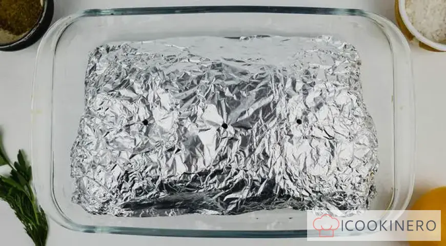 Red fish baked in foil with potatoes