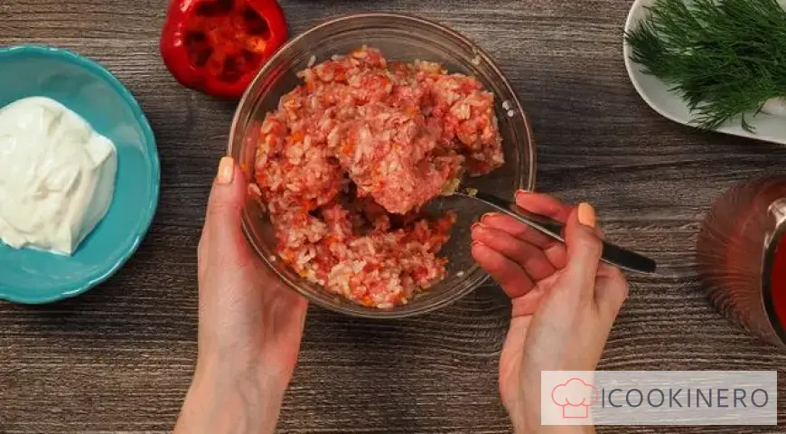 Peppers stuffed with meat in a saucepan