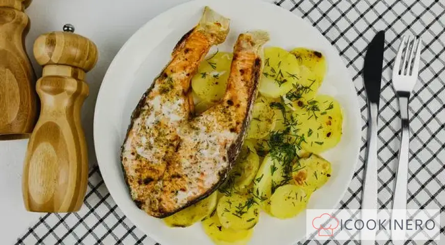 Red fish baked in foil with potatoes