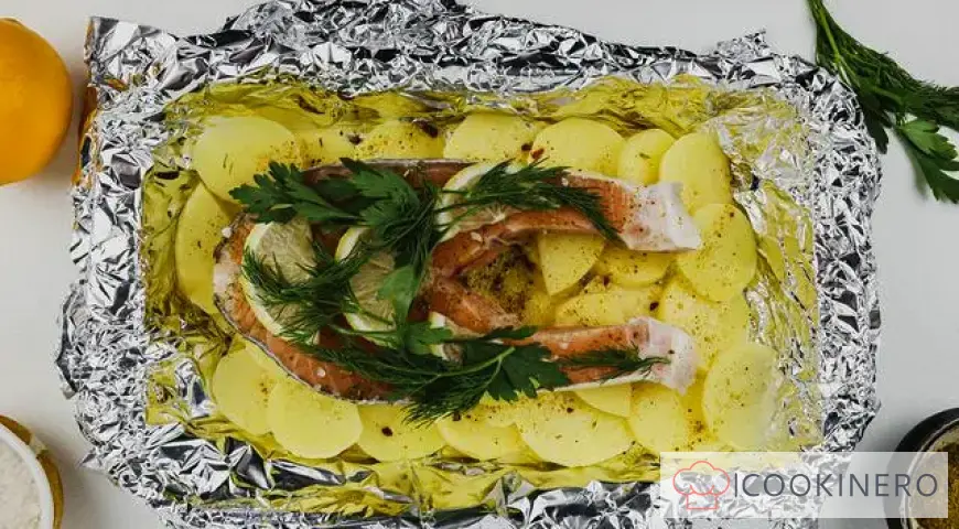 Red fish baked in foil with potatoes