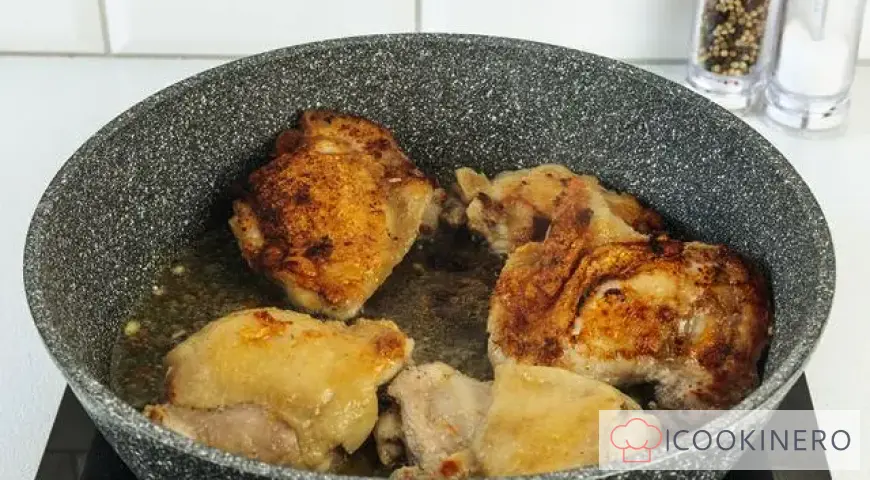 Chicken thighs in a frying pan