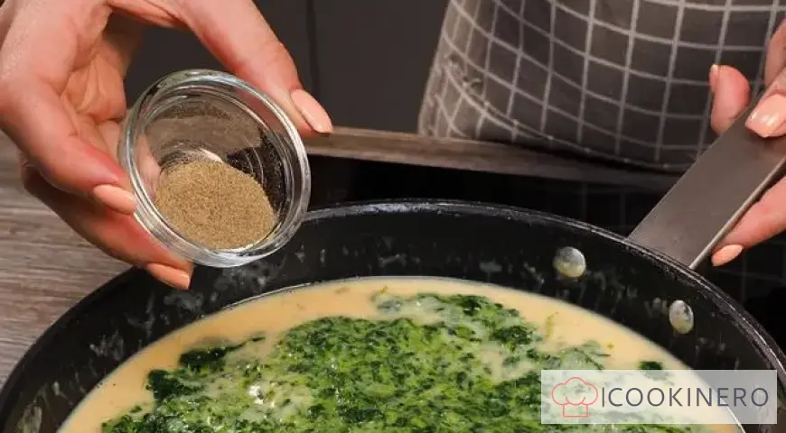Spinach in a creamy sauce with parmesan for garnish