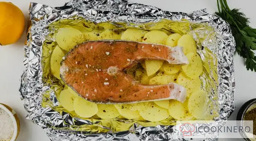 Red fish baked in foil with potatoes
