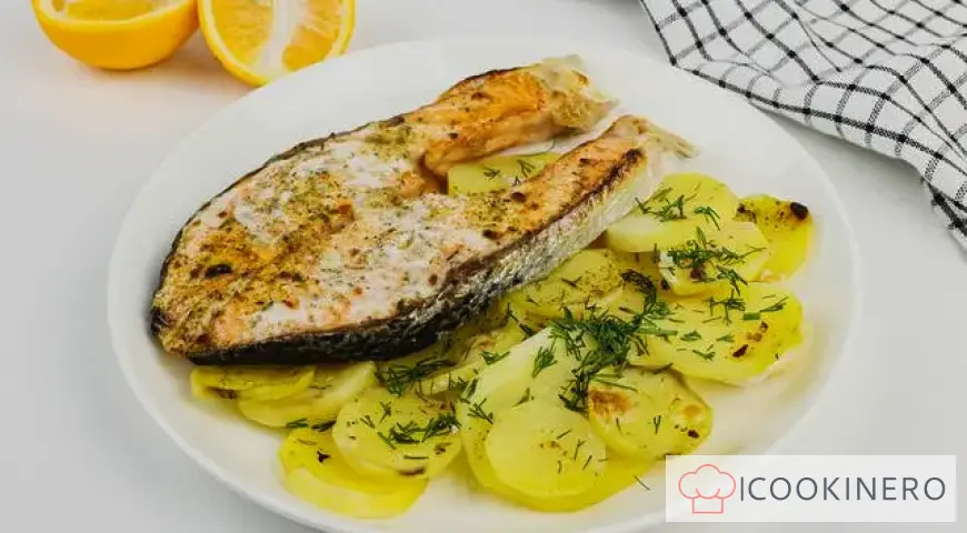 Red fish baked in foil with potatoes