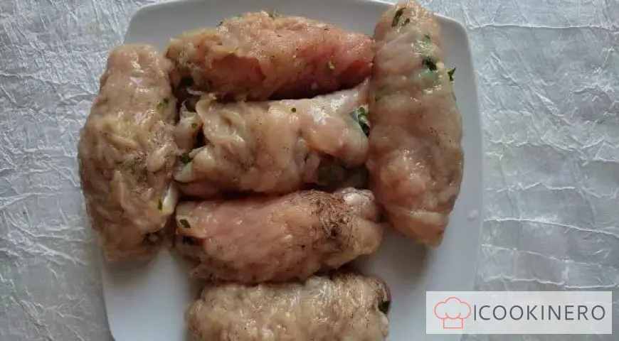 Appetizing chicken rolls with cheese and herbs