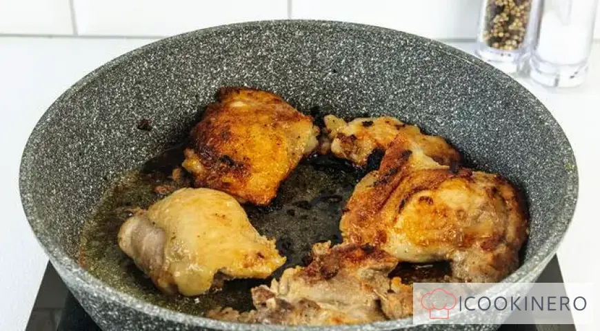 Chicken thighs in a frying pan