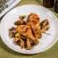 Baked chicken drumsticks with mushrooms