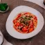 Pasta con salsiccia al sugo di pomodoro