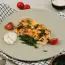Abadejo al horno bajo una capa de queso y crema agria