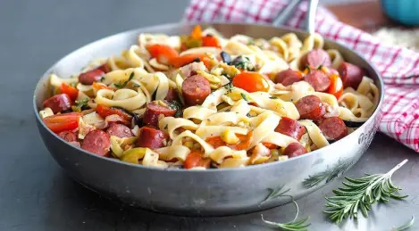 Pasta with sausages, olives and herbs