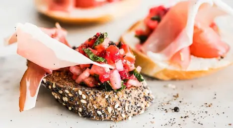 Tartine with strawberries and cured meat