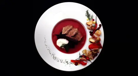 Cream-borscht with baked peppers, bacon rolls and baked garlic