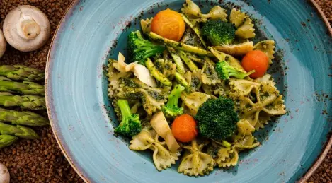 Pasta "Farfalle" with vegetables and pesto sauce