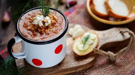 Vegetable puree soup with onion chips and Adyghe cheese