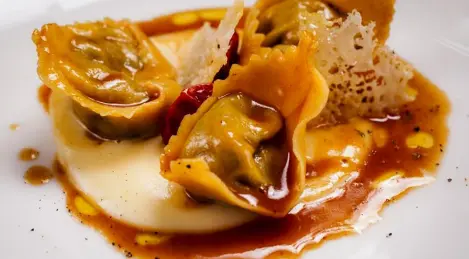 Ravioli with duck and parmesan sauce