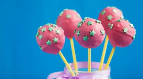 Cake pops with almond flour in strawberry glaze