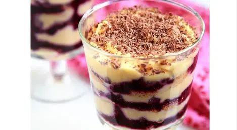 Tiramisu with orange syrup and blackcurrant puree